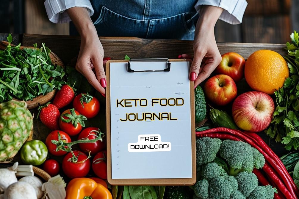 hands holding out a clipboard that says Keto Food Journal Free Download!  The clipboard is overtop of a variety of fresh fruits and vegetables.